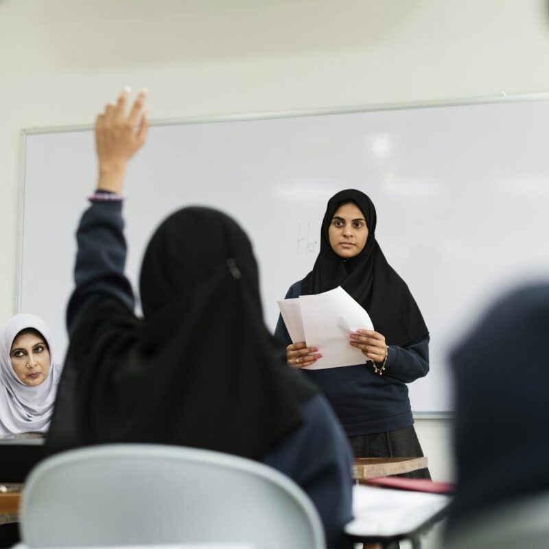 Diverse Muslim children studying in classroom